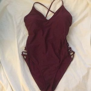 NEVER WORN 1 piece w/crisscross back+thigh accents